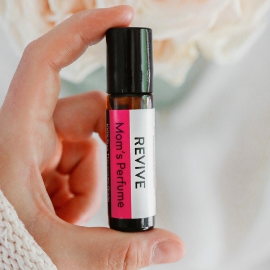 This is a limited edition Roll On!
REVIVE Mom's Perfume Roll-On blend smells amazing and will make you feel amazing too. This expertly formulated Essential Oil Perfume is crafted with oils that will help boost mood, warm the soul, and encourage connection with your feminine side. With cheerful top notes of Yuzu and Lime to the sensuous undertones of Jasmine and Vanilla, this perfume is fit for a Queen.
REVIVE MOM Roll-On is a proprietary blend of Caprylic/Capric Triglycerides (MCT) Oil, Yuzu, Lime, Jasmine, Vanilla Fruit Extract, Bay Leaf, and Wild Orange.

	
		
			
Free Shipping & Returns


		 
	 

	
		
			
GC/SM tested (Quality Tested)



		 
	 

	
		
			
No MLM Hassle