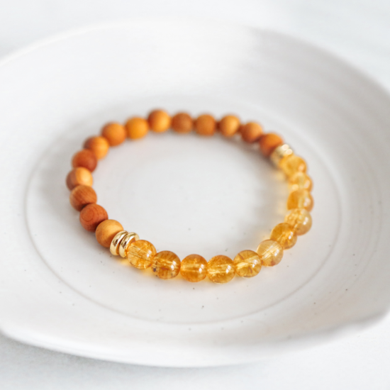 Diffuser Jewelry is a beautiful way to bring the benefits of Essential Oils everywhere you go!
The REVIVE Citrine diffuser bracelet is made with Citrine Stones and Thuja Wood Beads. It is a natural and simple look, so it pairs well as a bracelet stack or with any other jewelry. It is also beautiful as a solo piece for day to day wearing.
The Citrine Bracelet is 7.0"
Citrine Stones were chosen to accompany the Thuja Wood Beads because they are stones of positivity and vibrant energy. The Thuja Wood Beads hold Essential Oil aroma all day!