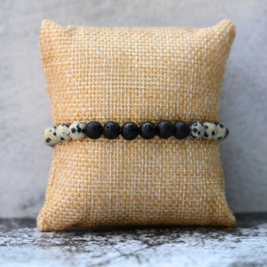 Diffuser Jewelry is a beautiful way to bring the benefits of Essential Oils everywhere you go!
The REVIVE Dalmatian diffuser bracelet is made with Dalmatian Stones and Black Lava Stones. It is a natural and simple look, so it pairs well as a bracelet stack or with any other jewelry. It is also beautiful as a solo piece for day to day wearing.
The Dalmatian Stone Bracelet is 6.5 & 7.0"
Dalmatian Stones were selected to complement the Black Lava Stones because they are known for their ability to uplift the spirit, inspire optimism, and foster a sense of lightness and joy. The Black Lava Stones hold Essential Oil aroma all day!